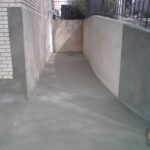 Driveway Overlay In Plain Gray With Retaining Wall