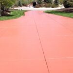 Terra-Cotta-Solid-Color-Stained-Driveway