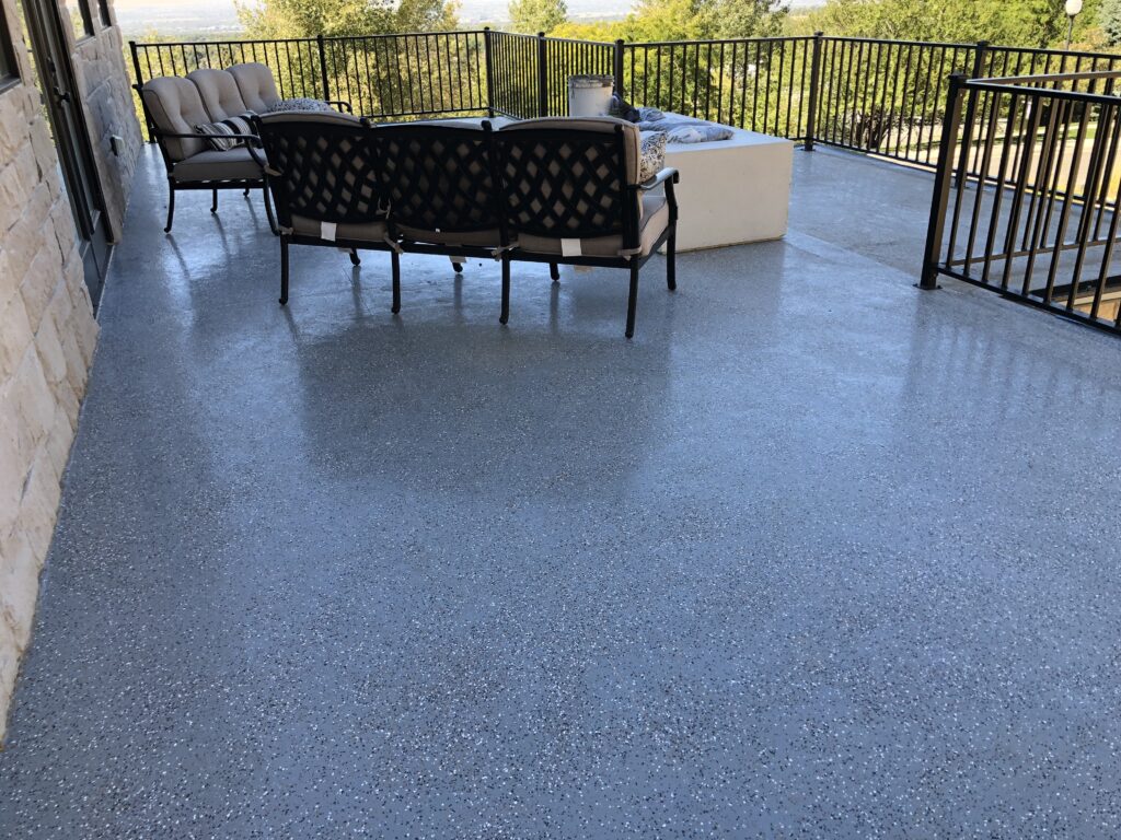 dolphin gray urethane waterproofing with color chips over a garage