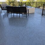 dolphin gray urethane waterproofing with color chips over a garage
